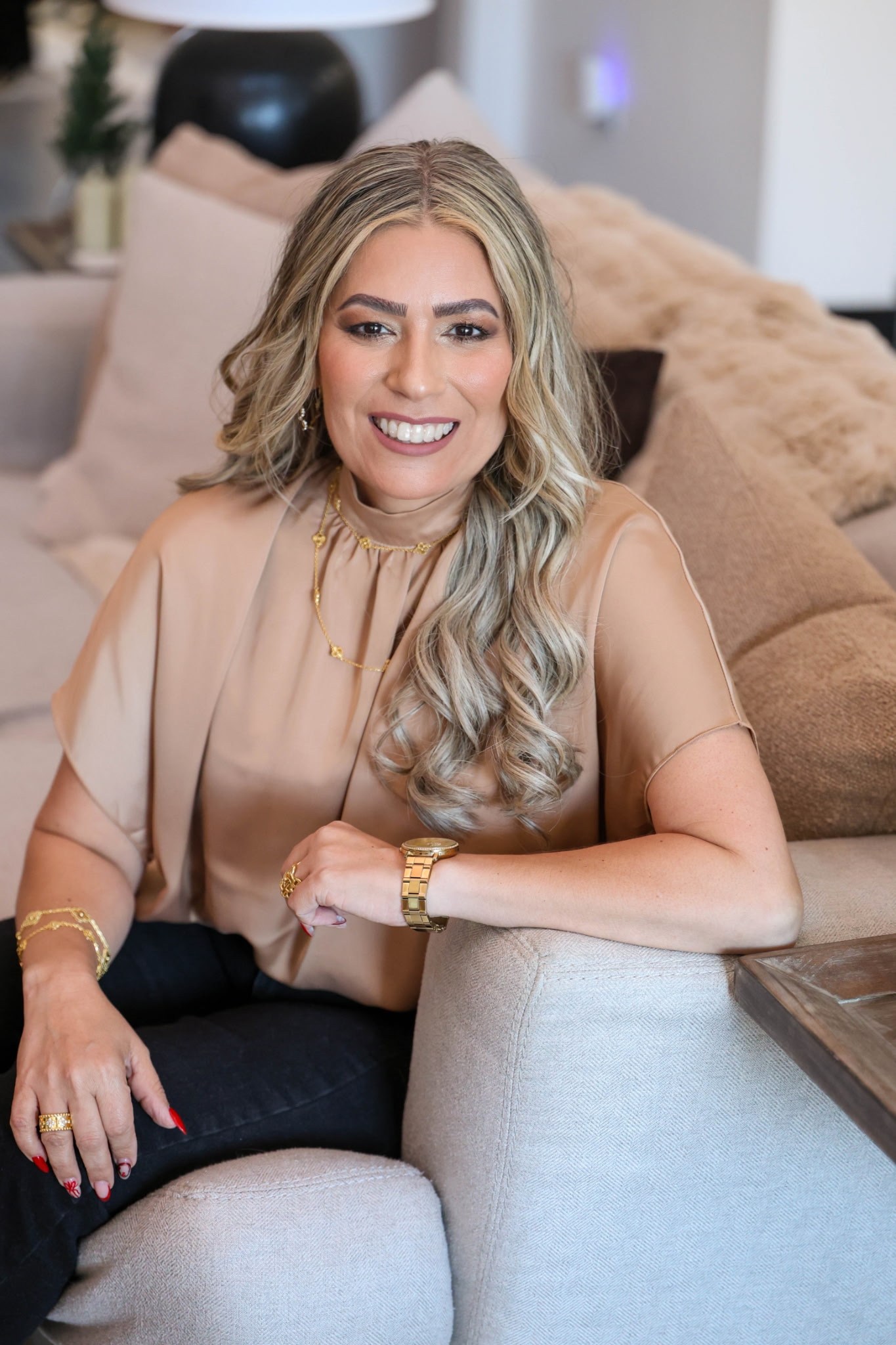 Sherlyn standing confidently in a white suit at Sky Consultants Realty